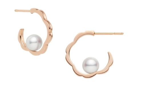 A pair of floral-inspired Mikimoto earrings, each with a delicate pearl in the center, available at Adlers Jewelers.