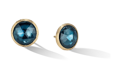 A pair of simple but elegant topaz stud earrings set in yellow gold bezels, available at Adlers Jewelers.