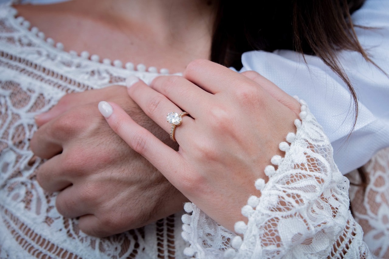 A cushion cut side stone ring