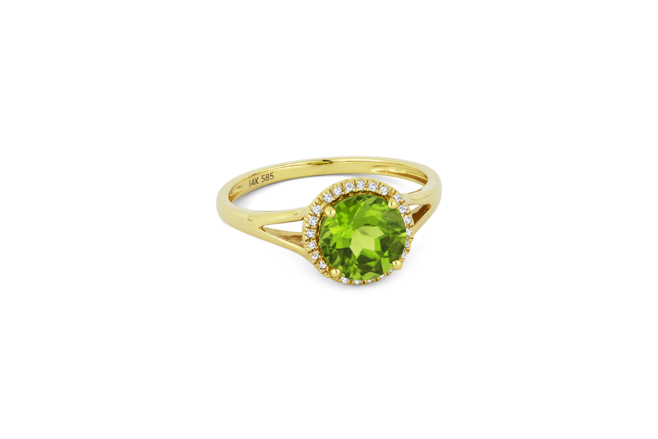 A golden fashion ring with a large circular peridot center stone and a diamond halo.