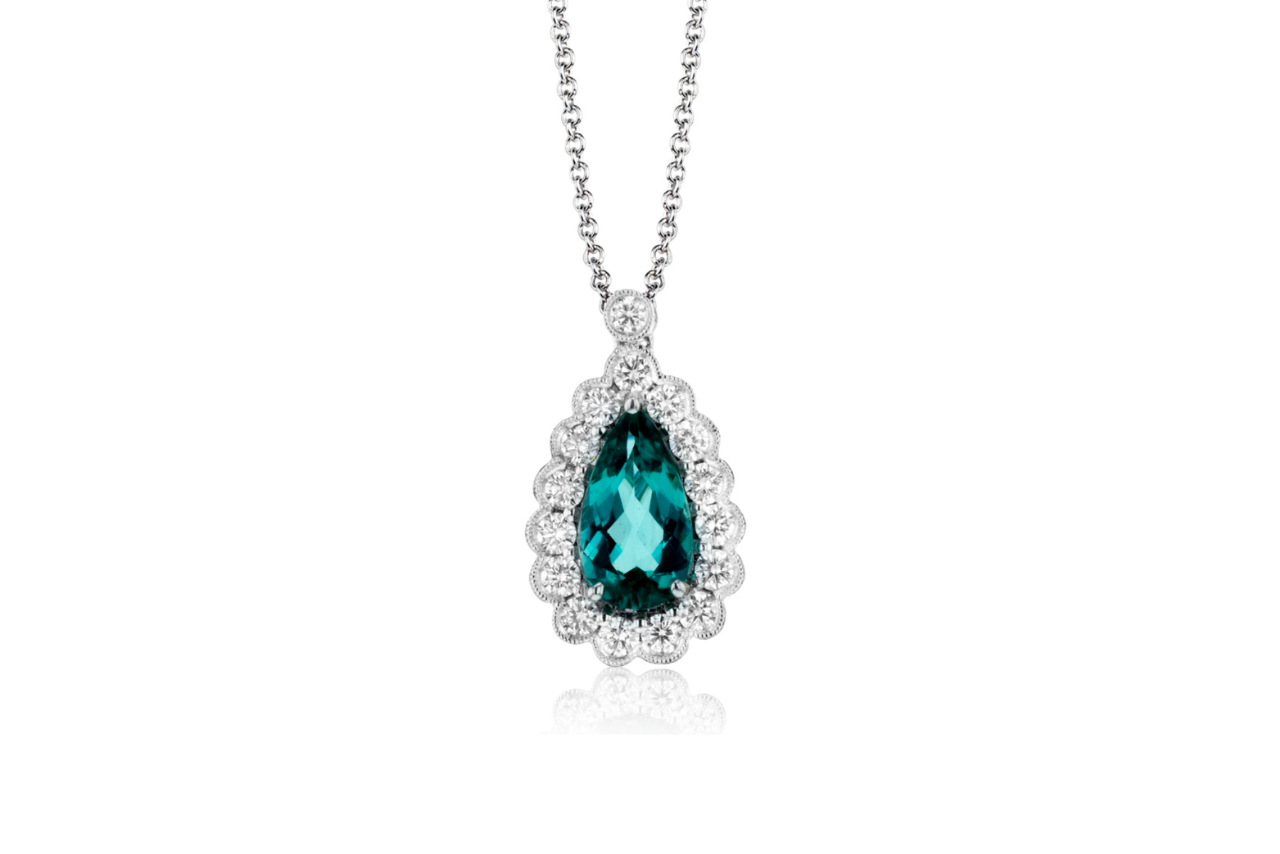 A teardrop silver aquamarine and diamond pendant.