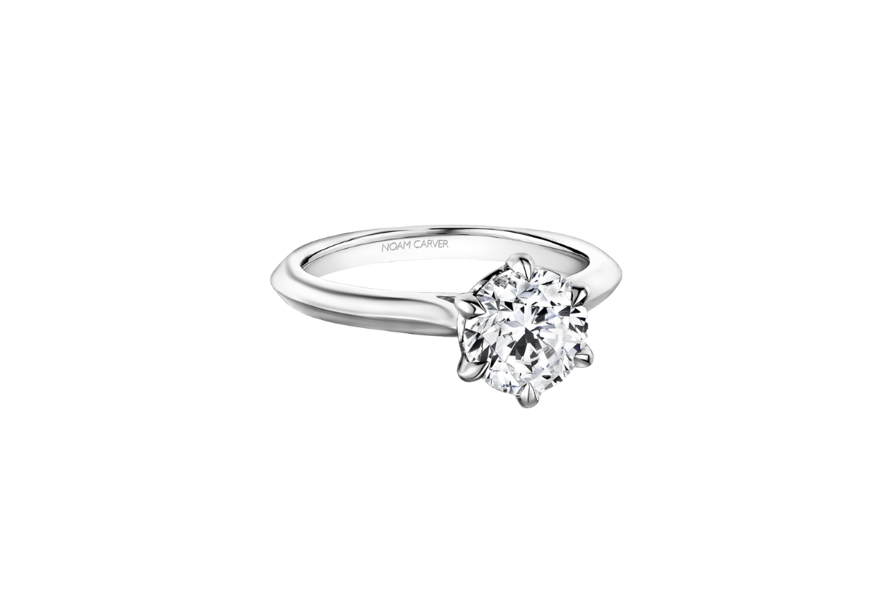 A simple, elegant engagement ring with a gorgeous center diamond and plain band.