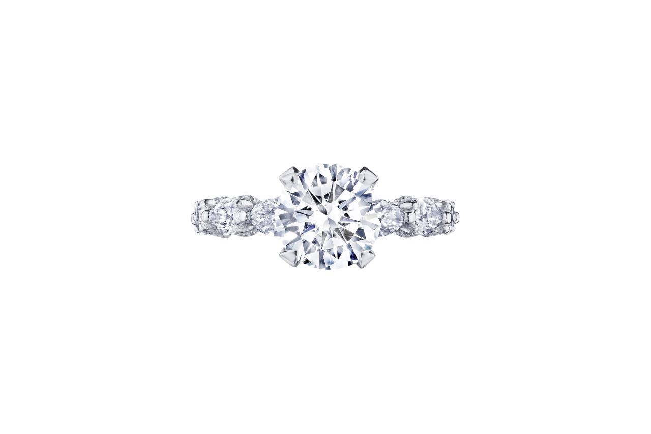 A sparkling diamond engagement ring with a chunky diamond band and a circular center stone.