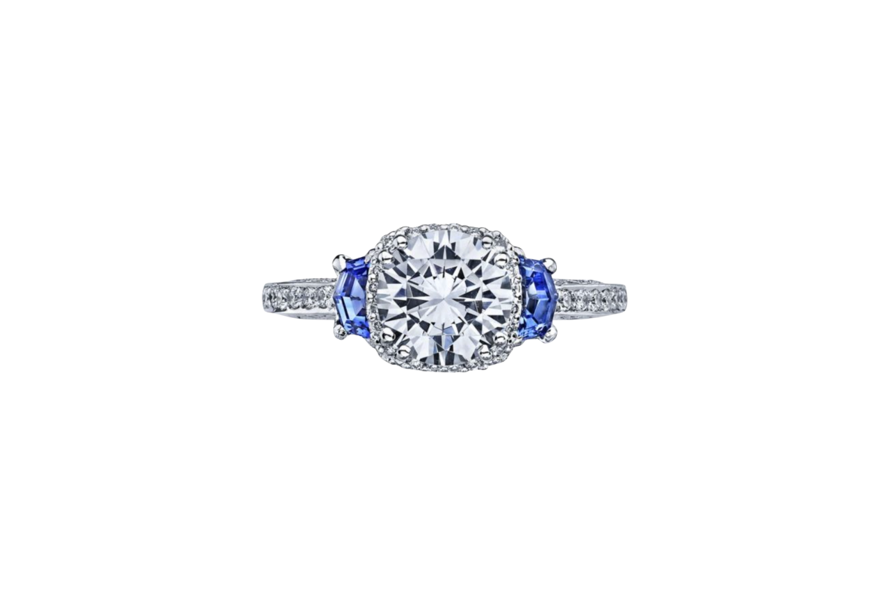 A dazzling three-stone engagement ring, with the two side stones a beautiful dark blue.