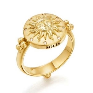 a gold signet ring with a sun motif and diamond accents from Temple St. Clair.
