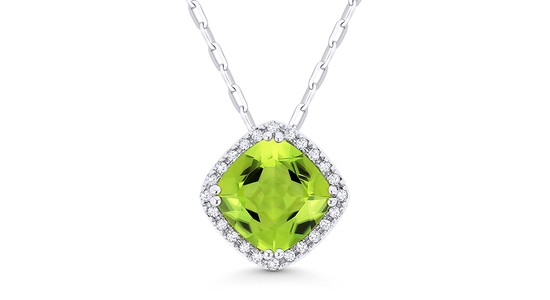 a white gold pendant necklace with a cushion cut peridot