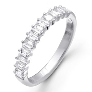 a Simon G. wedding band for women, adorned with pave-set baguette-cut diamonds.