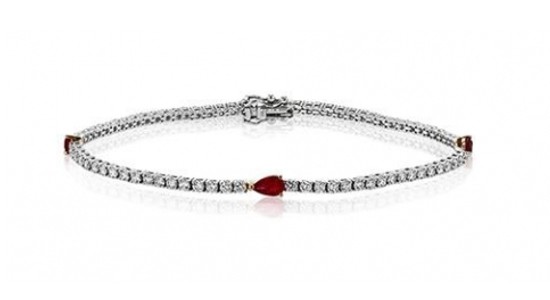 a silver diamond tennis bracelet featuring three pear shape rubies
