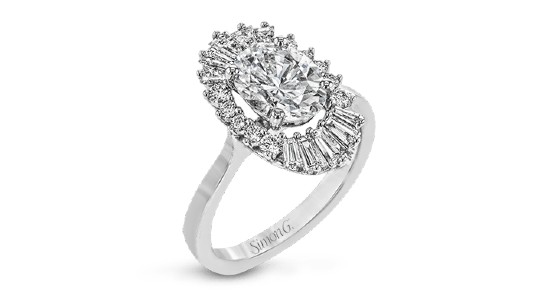 a white gold engagement ring with an oval cut center stone and halo made of different cuts of diamonds