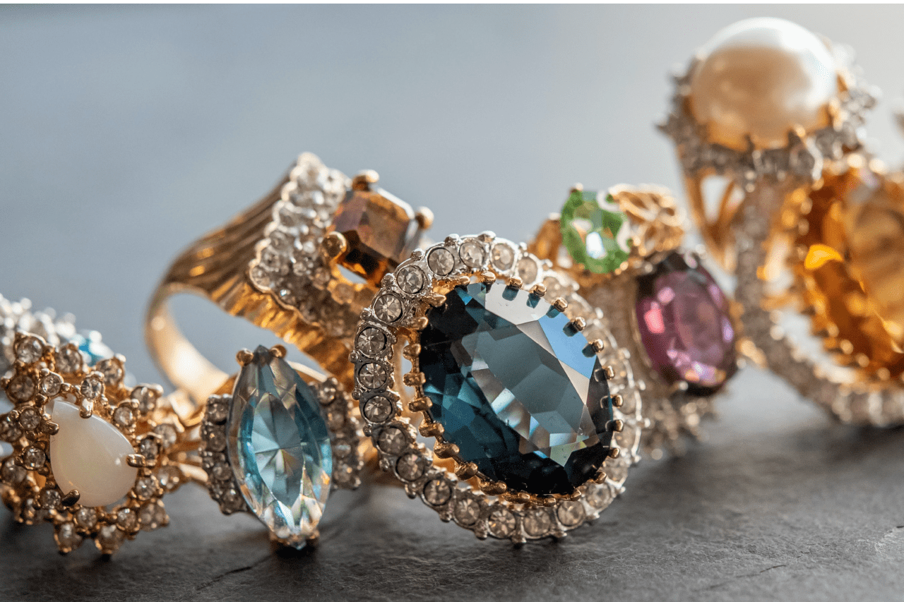 A collection of ornate gold rings with various gemstones.